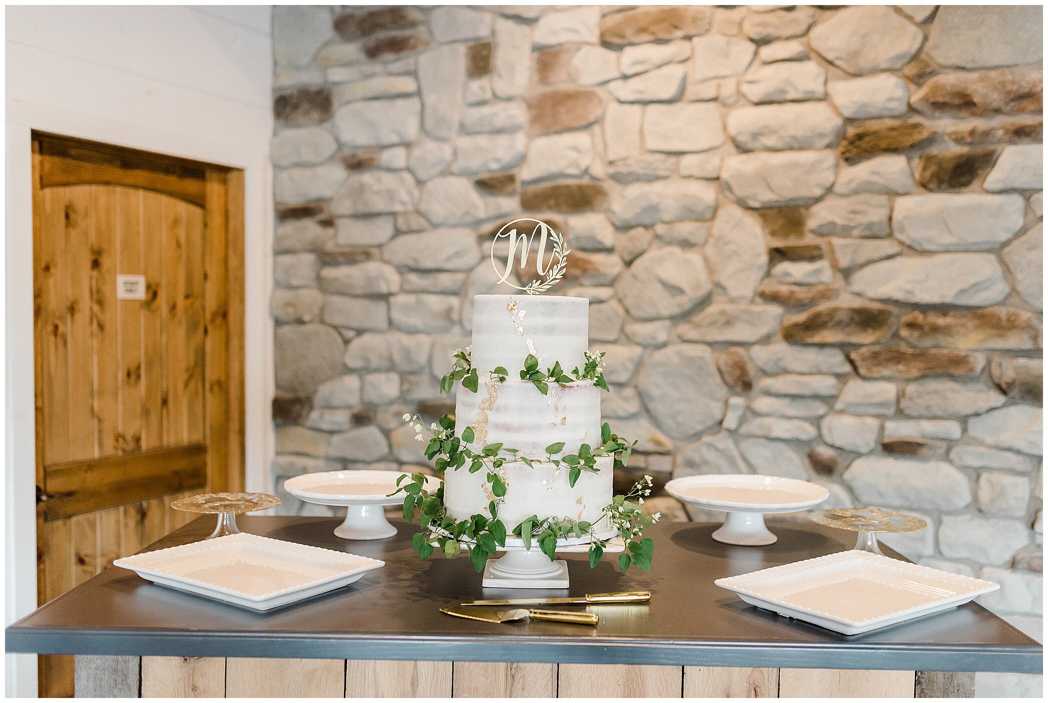 tiered wedding cake with greenery accents