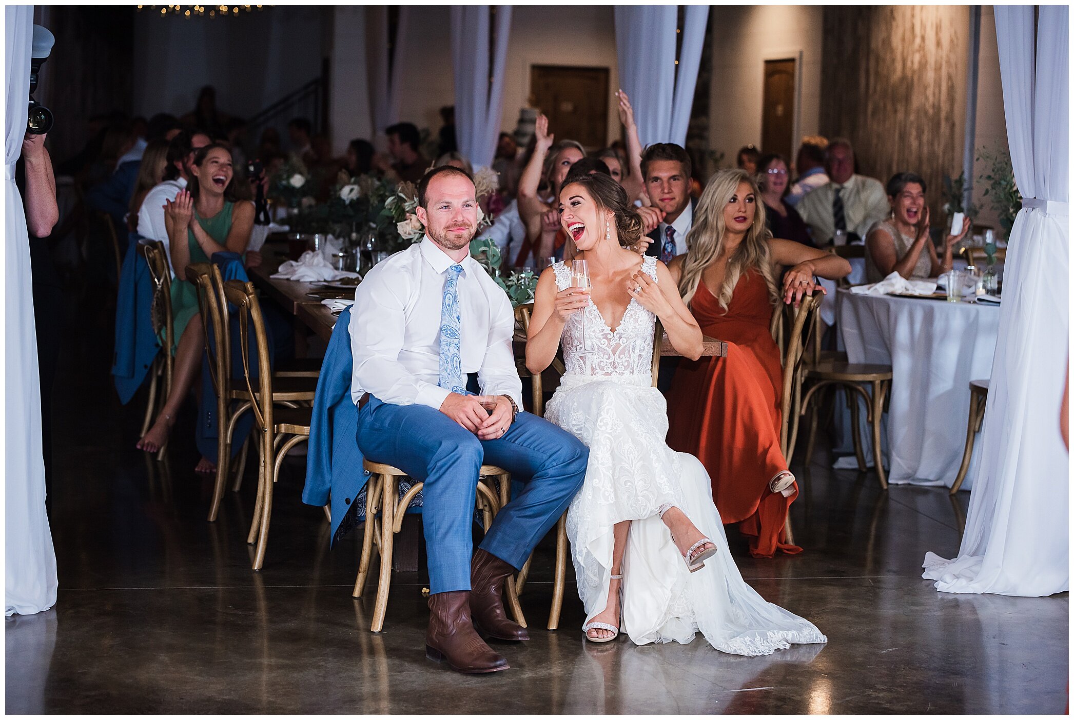 newlyweds laugh during wedding toast at Granary at Valley Pike
