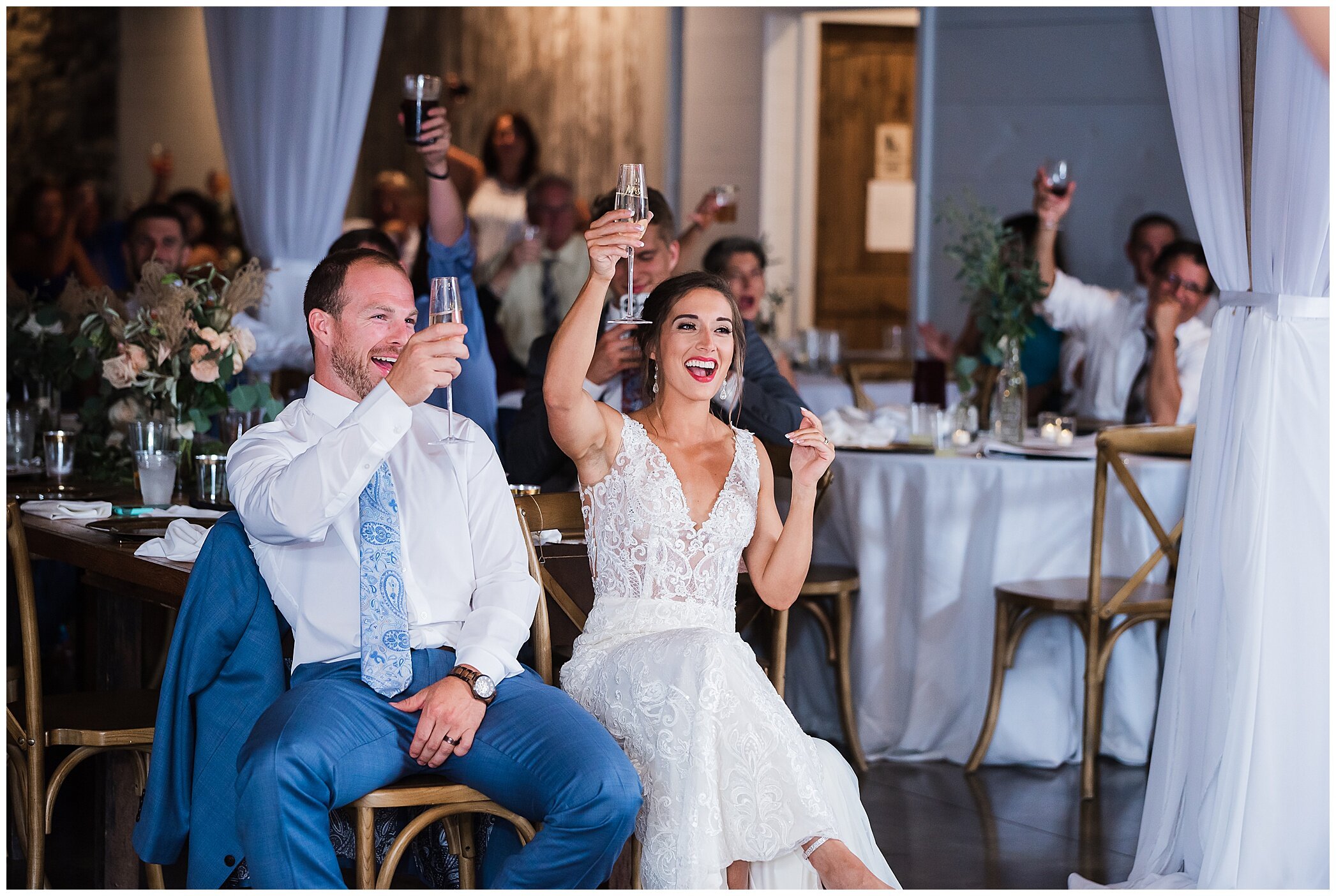 bride and groom listen to toasts during VA wedding reception