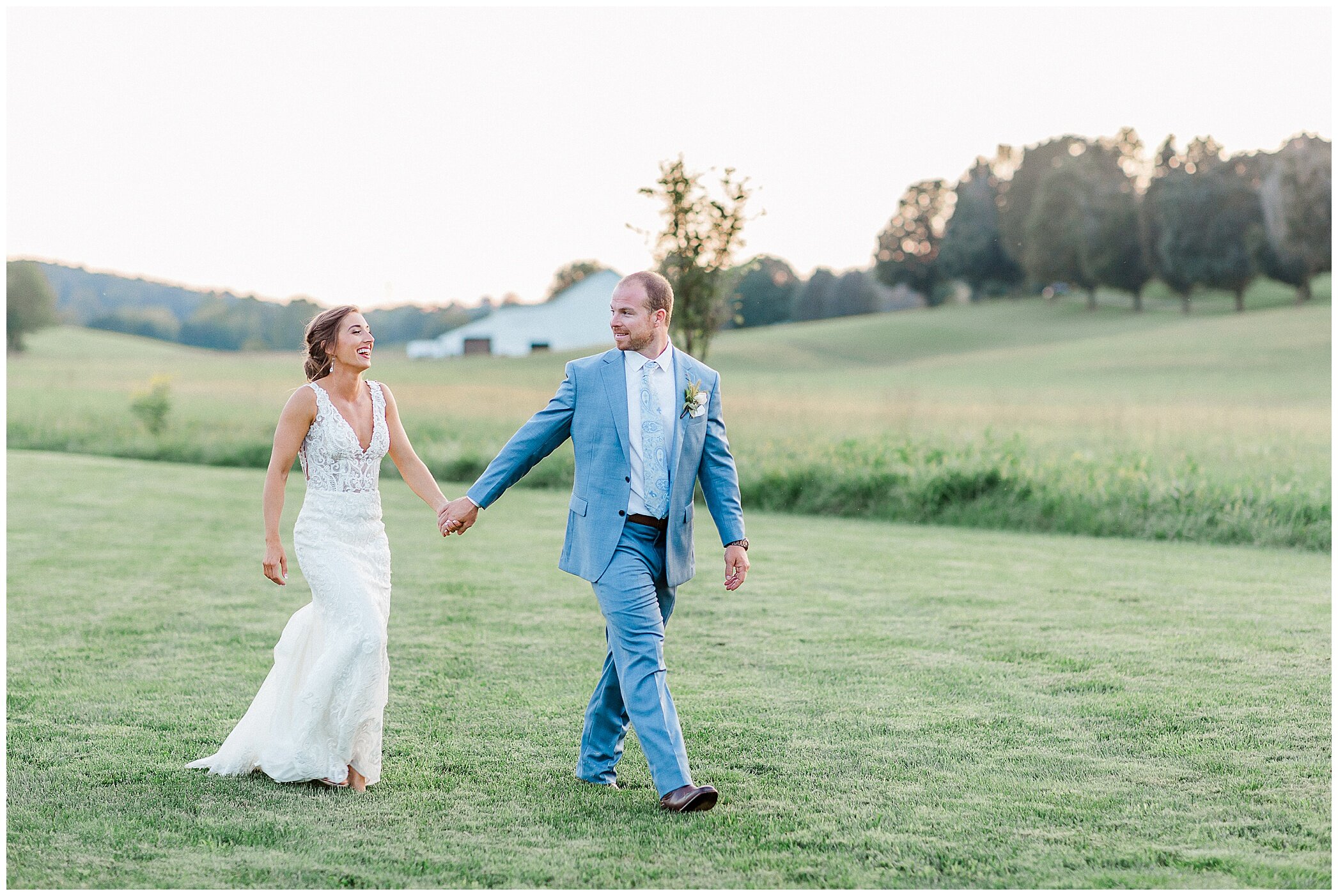 newlyweds walk through grounds at Granary at Valley Pike