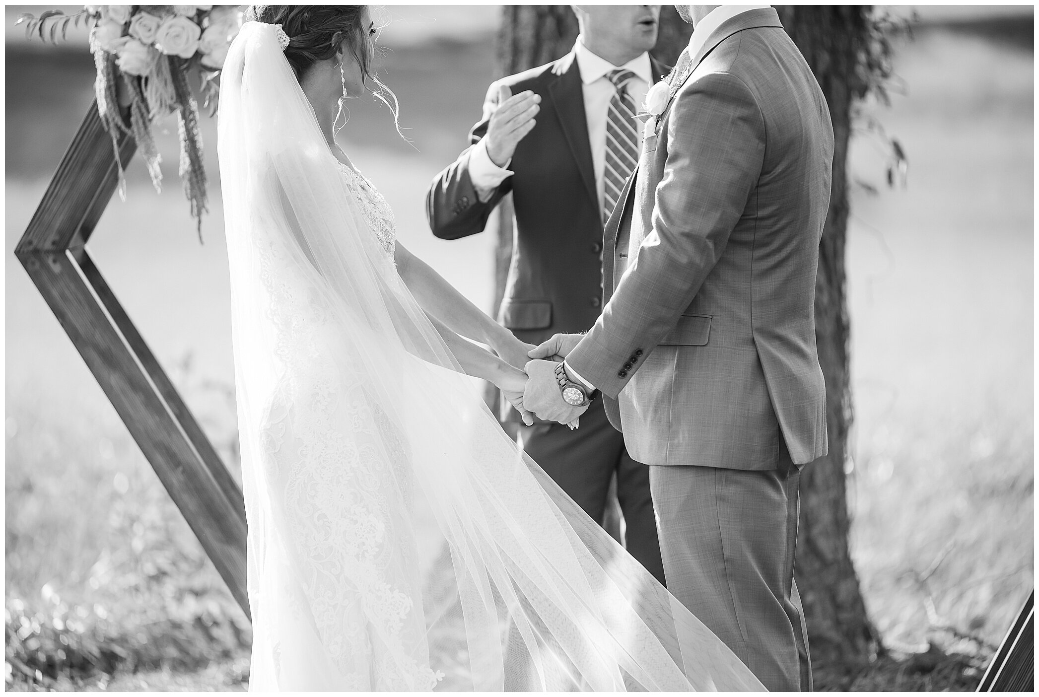 bride and groom hold hands during VA wedding ceremony