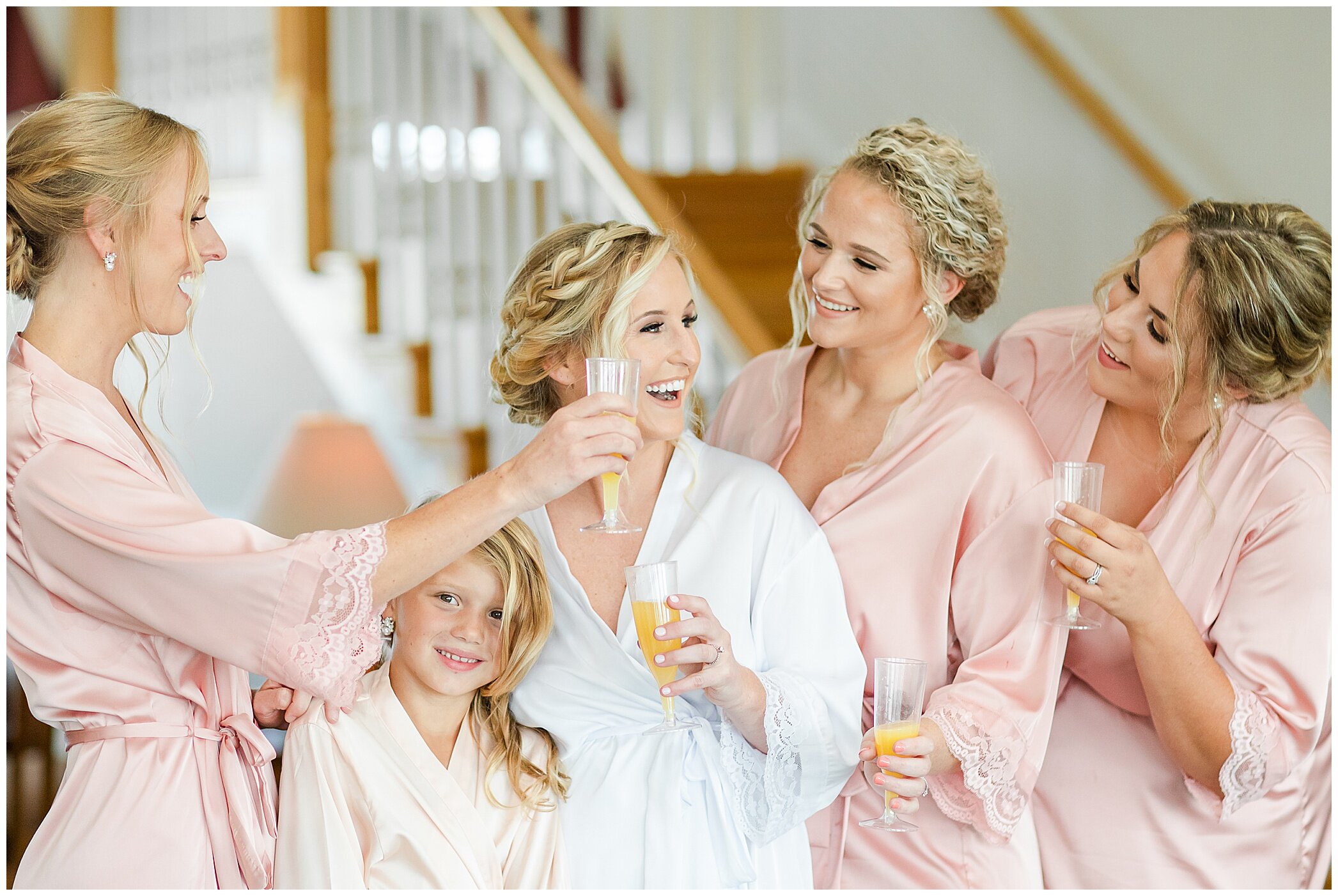 bride and bridesmaids prepare for Planter's Club wedding in matching robes