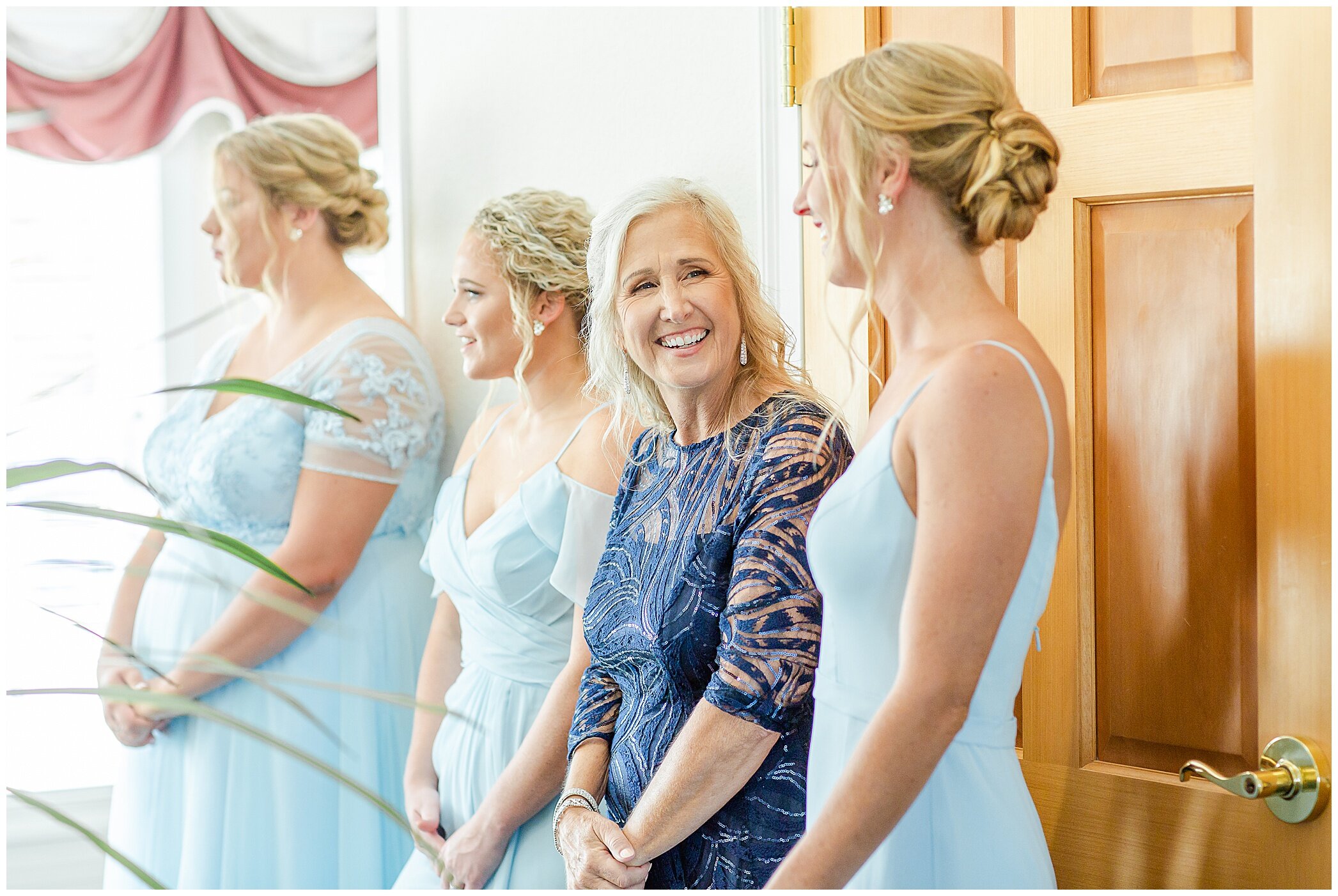 bridesmaids and mother of the bride watch bride
