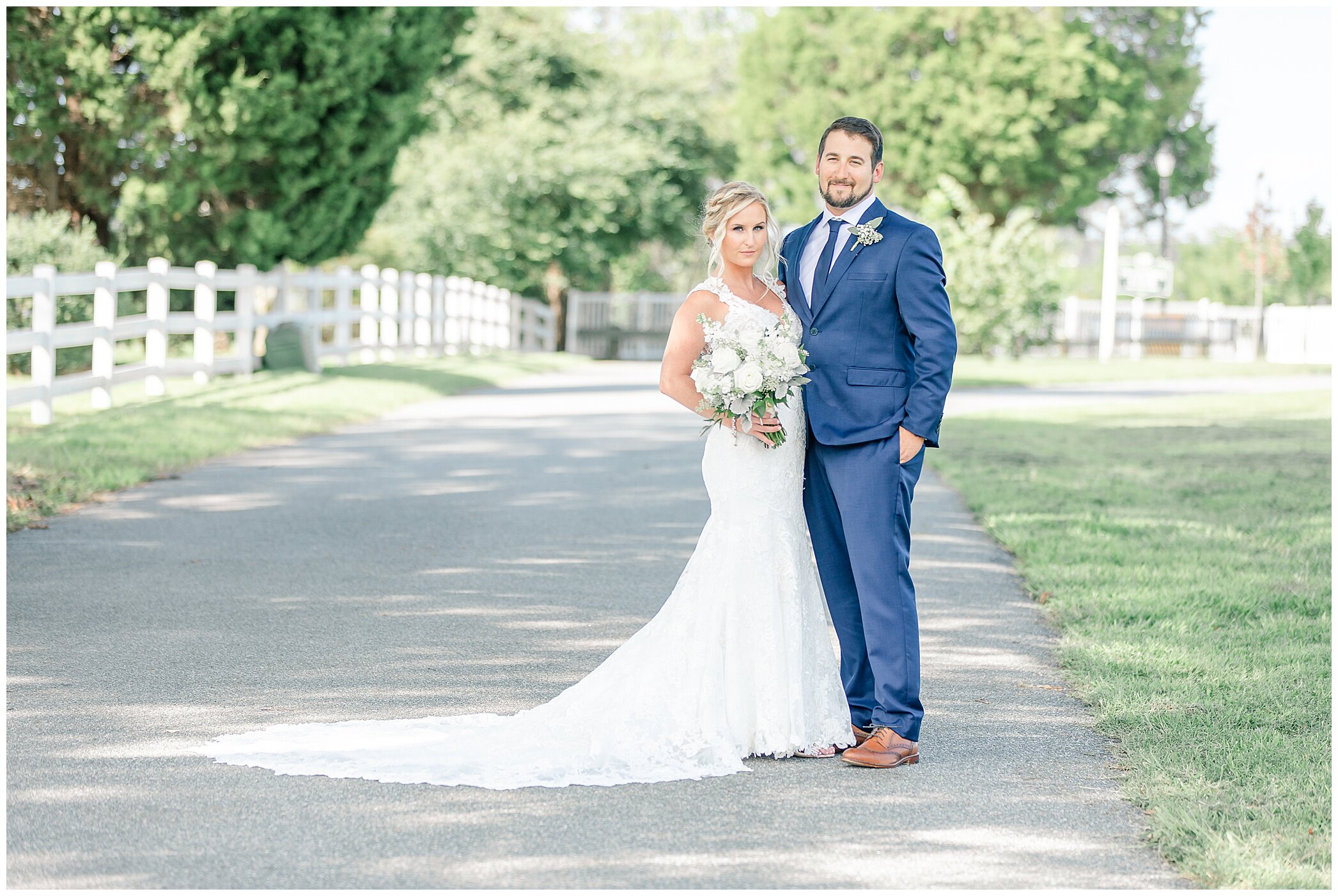 bride and groom pose along driveway at Planter's Club
