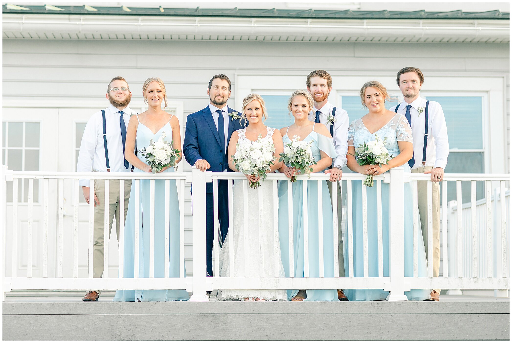 wedding party stands on balcony at Planter's Club