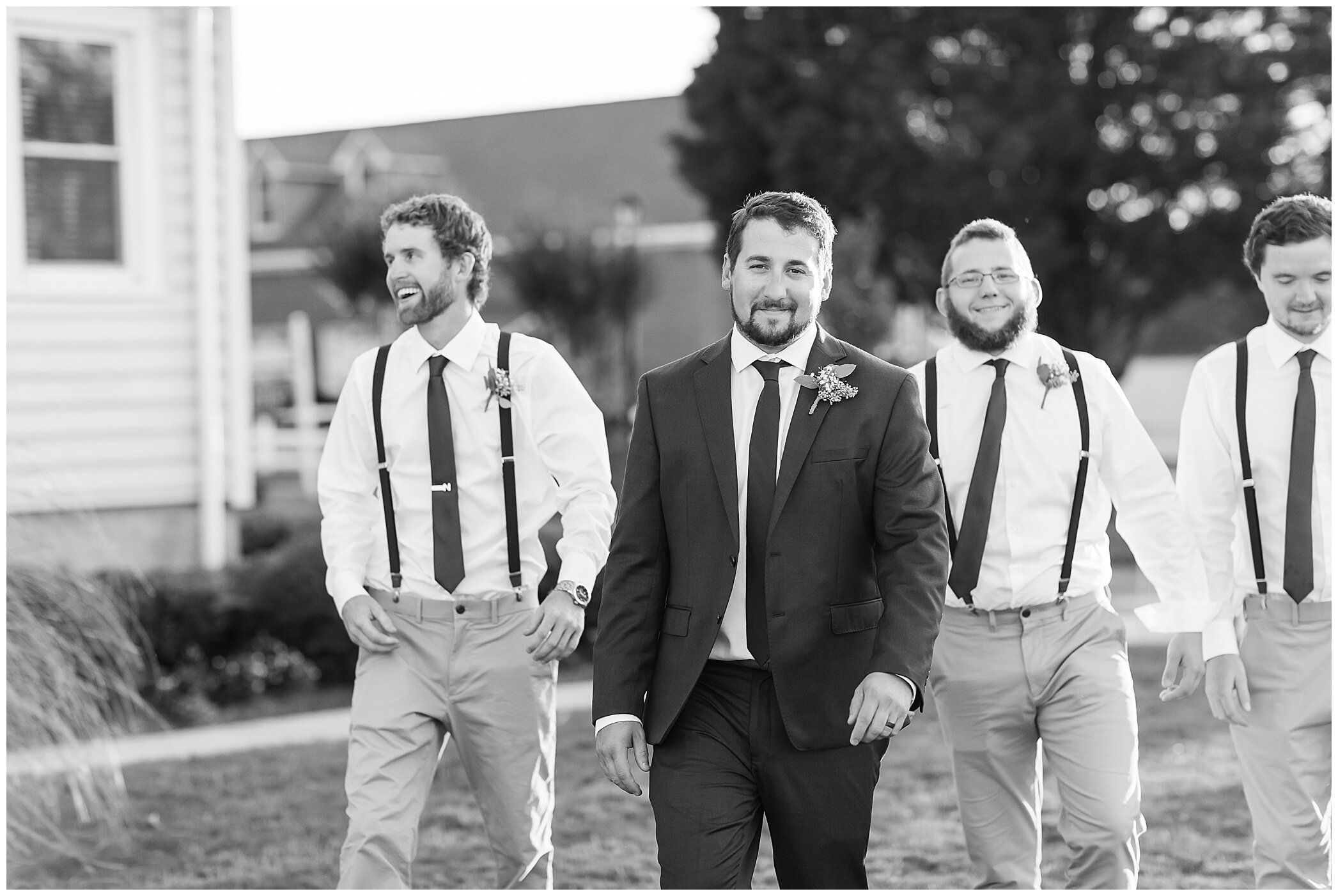 groom walks with groomsmen at Planter's Club