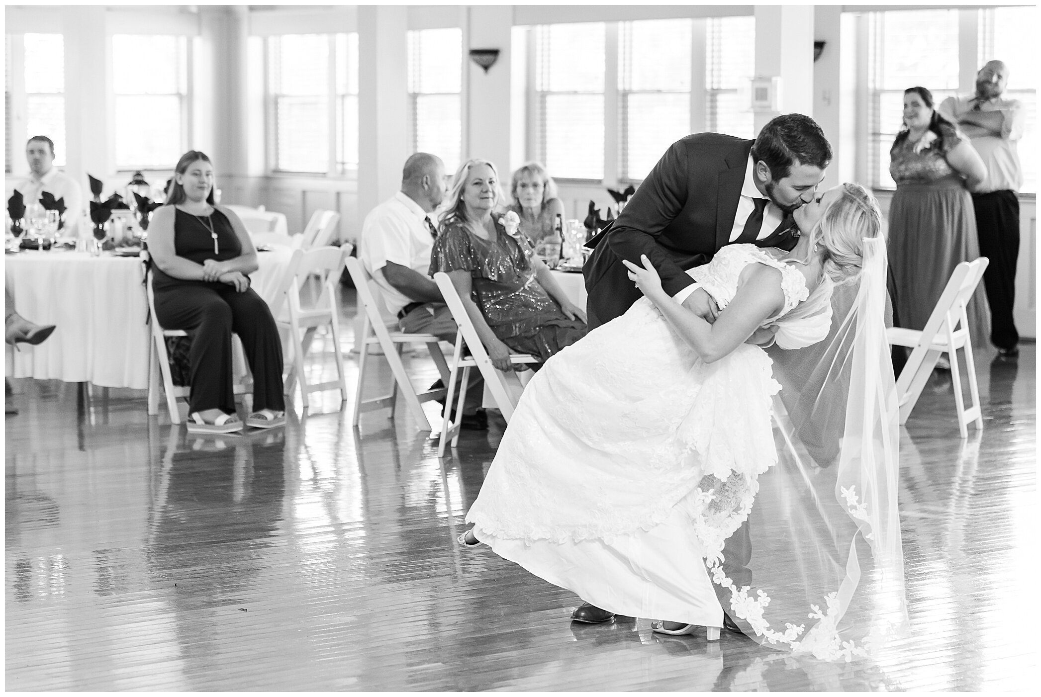 bride and groom kiss during first dance at Planter's Club wedding reception