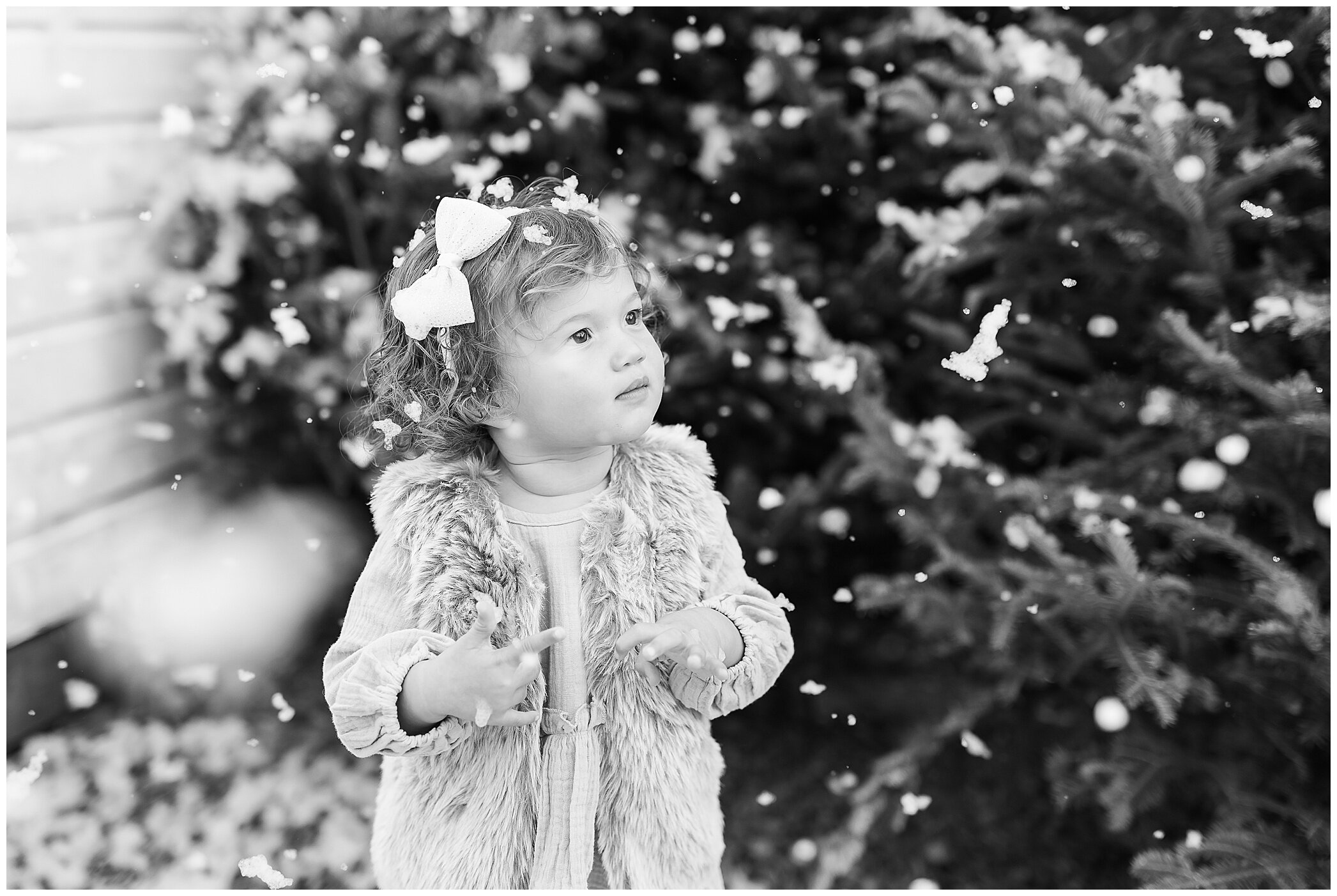 Christmas mini sessions with Ryann Winn Photography at Fleur de Fou with toddler playing in fake snow
