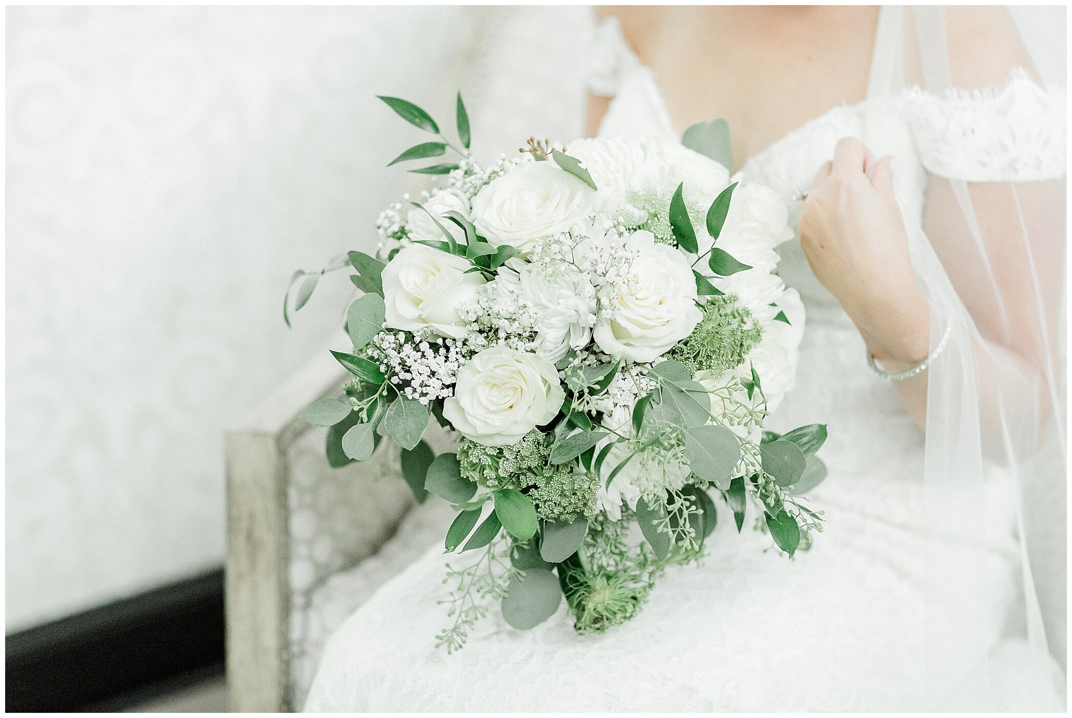 bride holds all white bouquet for VA wedding