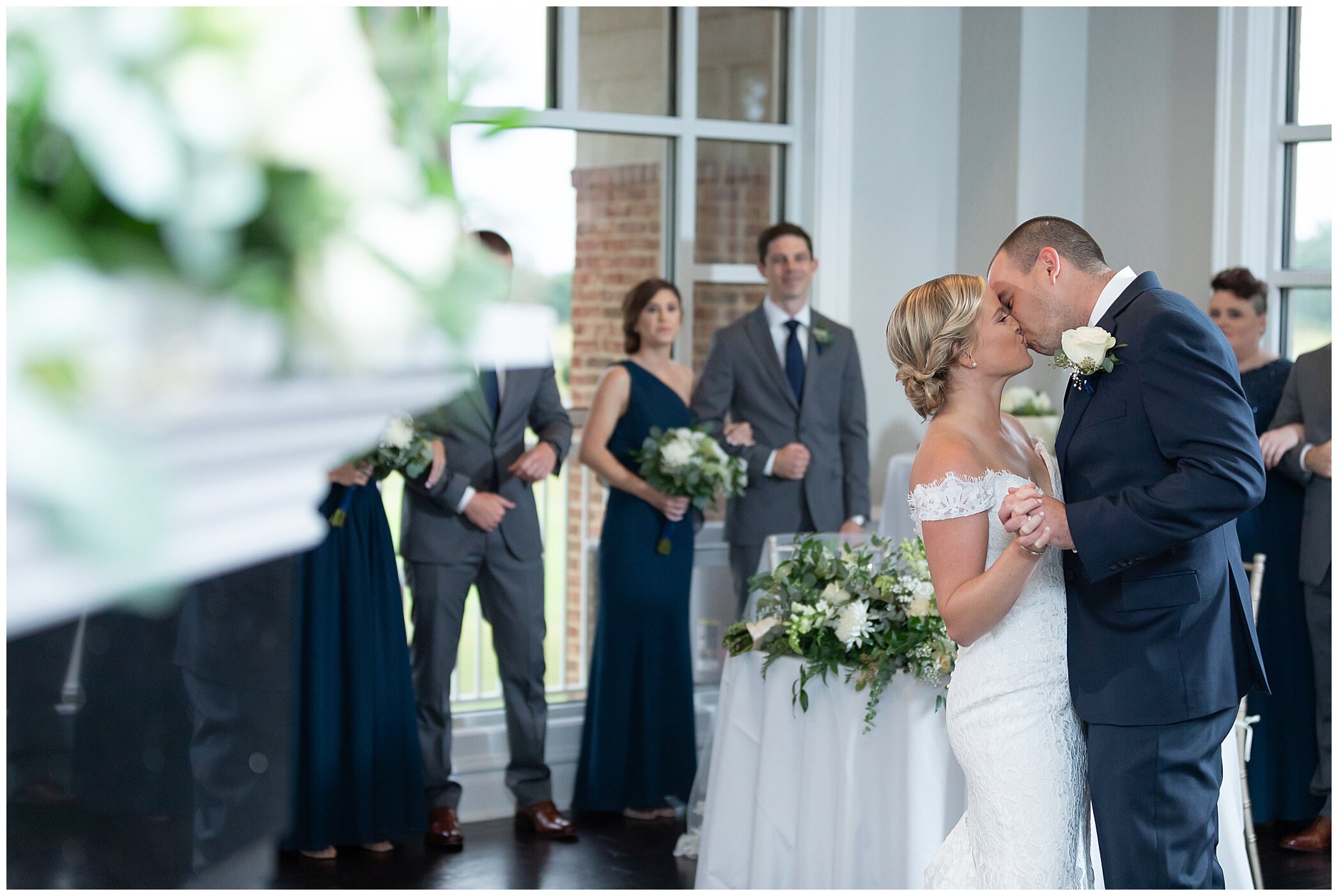 bride and groom kiss during Newport News VA wedding reception
