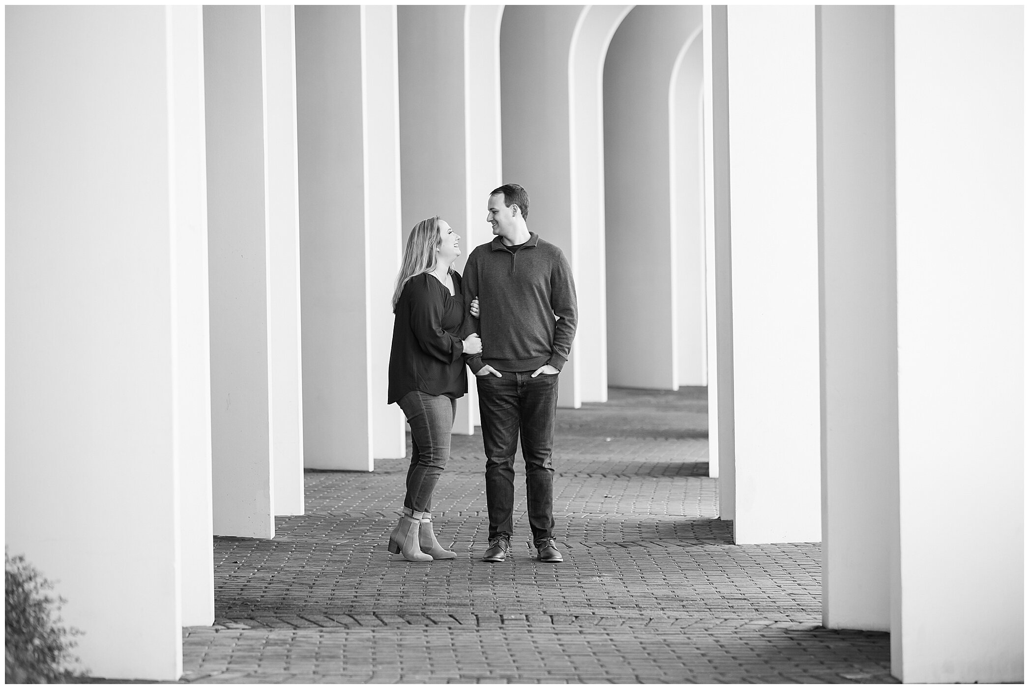 engaged couple poses together during winter Christopher Newport University engagement session