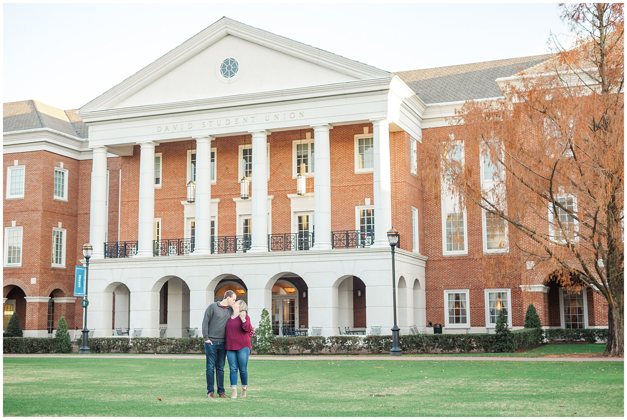 groom and fiancee pose by library at Christopher Newport University