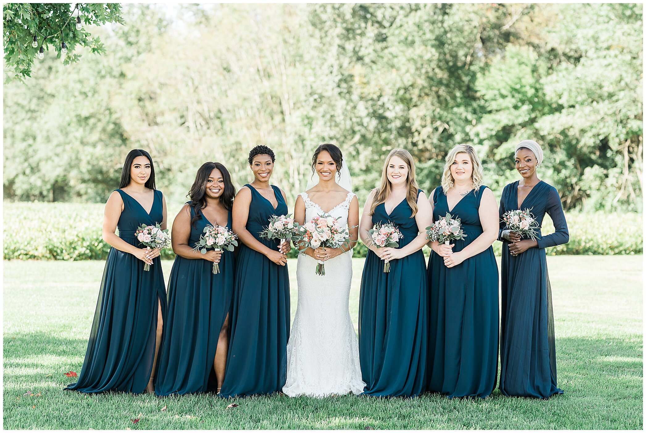 bride poses with bridesmaids in teal gowns before Barns at Timberneck wedding