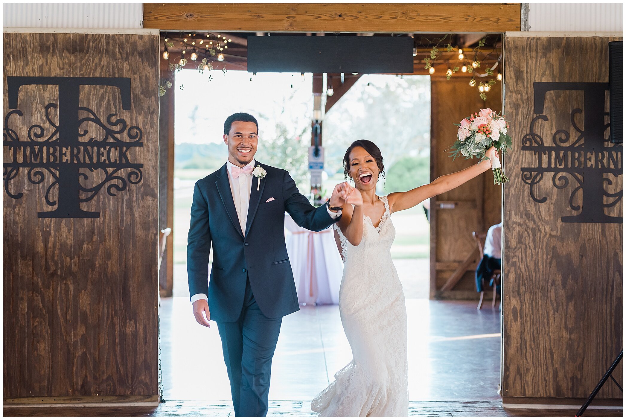 bride and groom enter The Barn at Timberneck reception